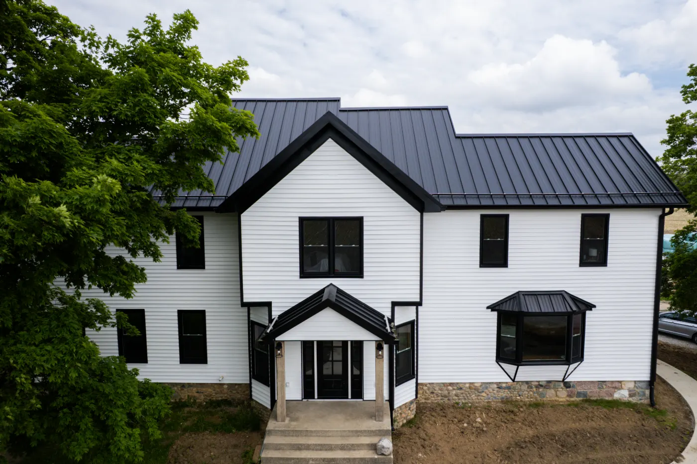 Siding installation documented in Sand Creek Woods